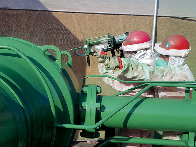 Protal 7200 being spray applied to a pipe